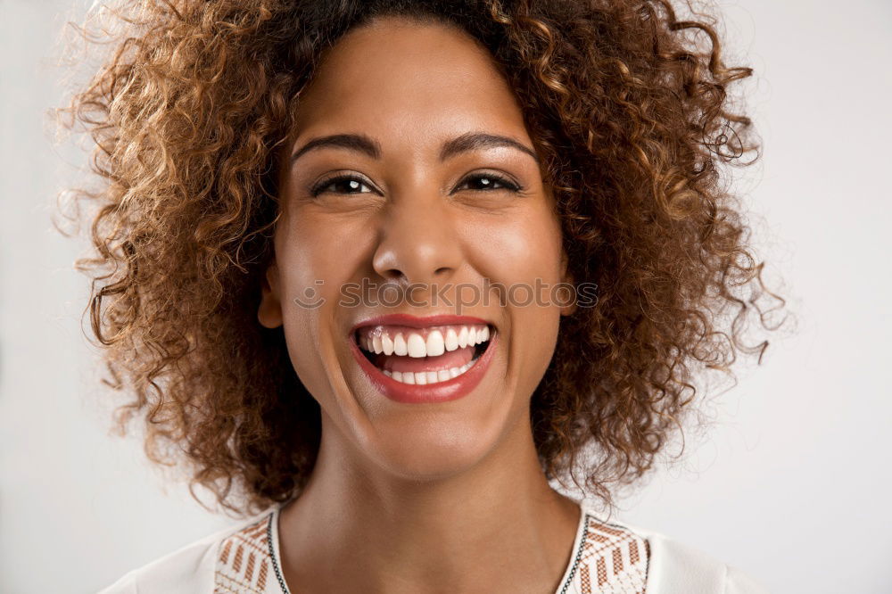 Similar – Portrait of a young black woman smiling with braces