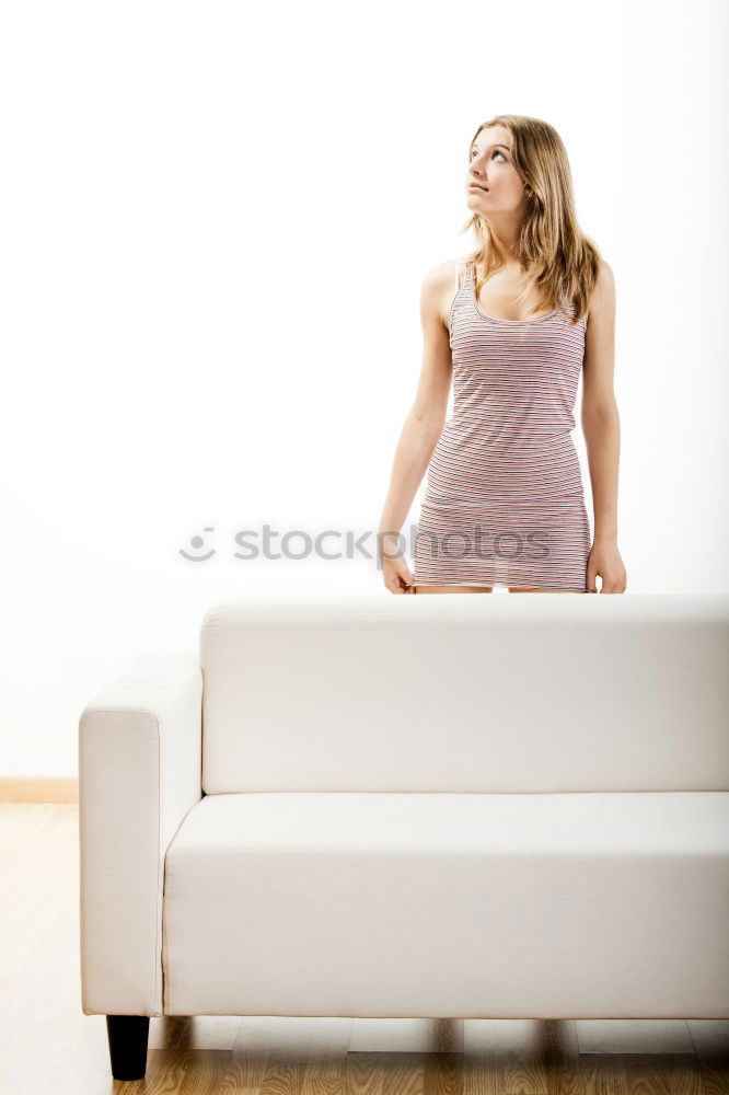 Image, Stock Photo young redhead woman with curls and freckles sprints barefoot in hot pants in front of white door and smiles