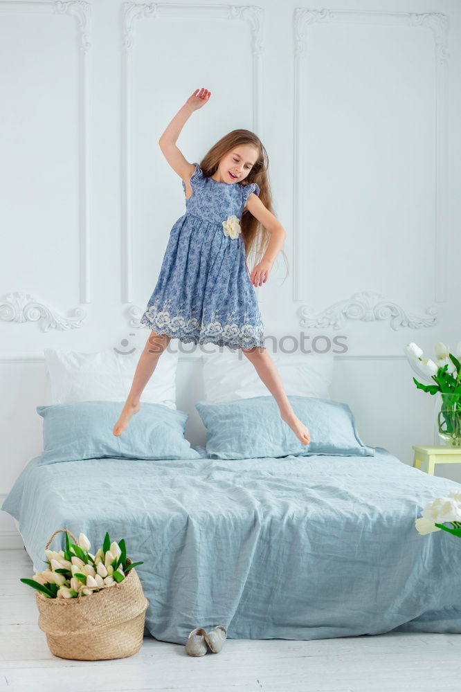 Similar – beautiful kid girl jumping on bed