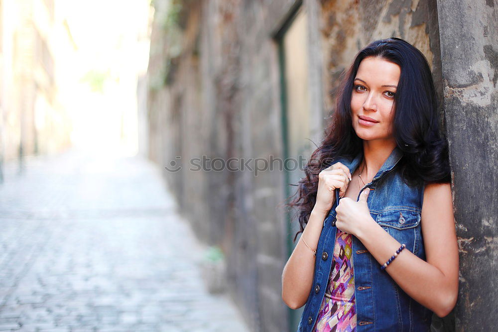 Similar – Mixed woman in urban background wearing casual clothes