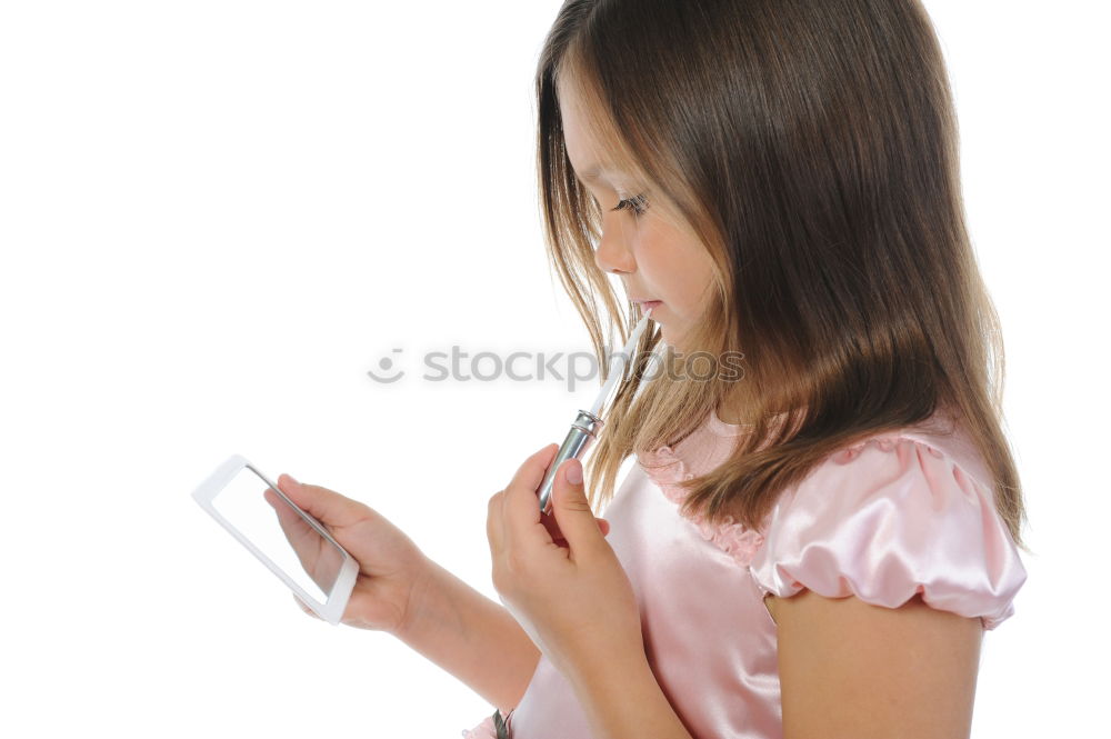 portrait of a beautiful kid using mobile phone