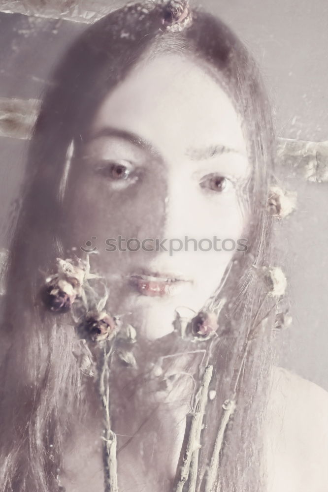 Similar – Double exposure portrait of a young woman, with flowers and branches in half-transparency