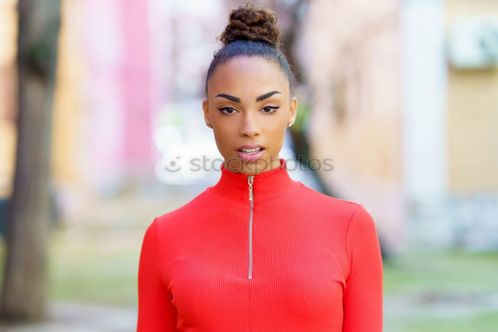 Similar – Happy black woman in red dress in front of a green wall