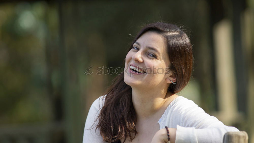 Similar – Girl with blue eyes smiling sitting on urban step