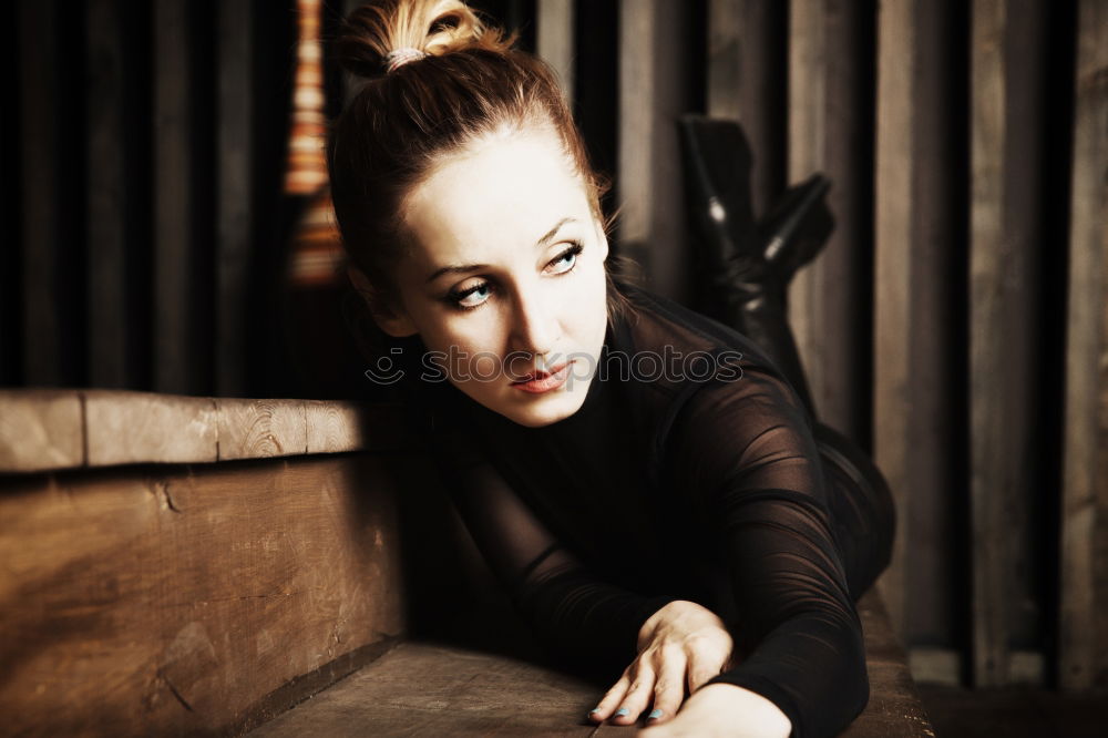 Similar – young leggy woman with pink hair sits in front of couch