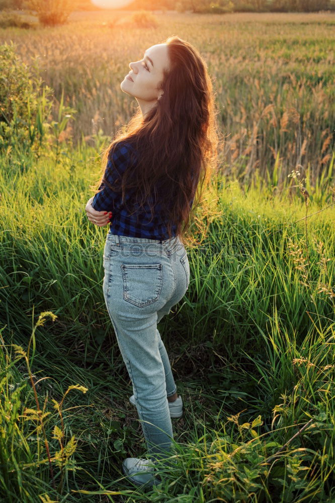 Similar – Image, Stock Photo Young woman sitting in a green rural path