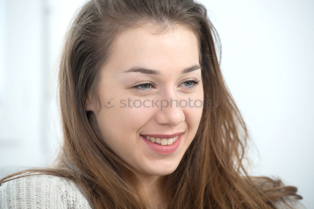 Similar – Close-up portrait of young woman with beautiful blue eyes