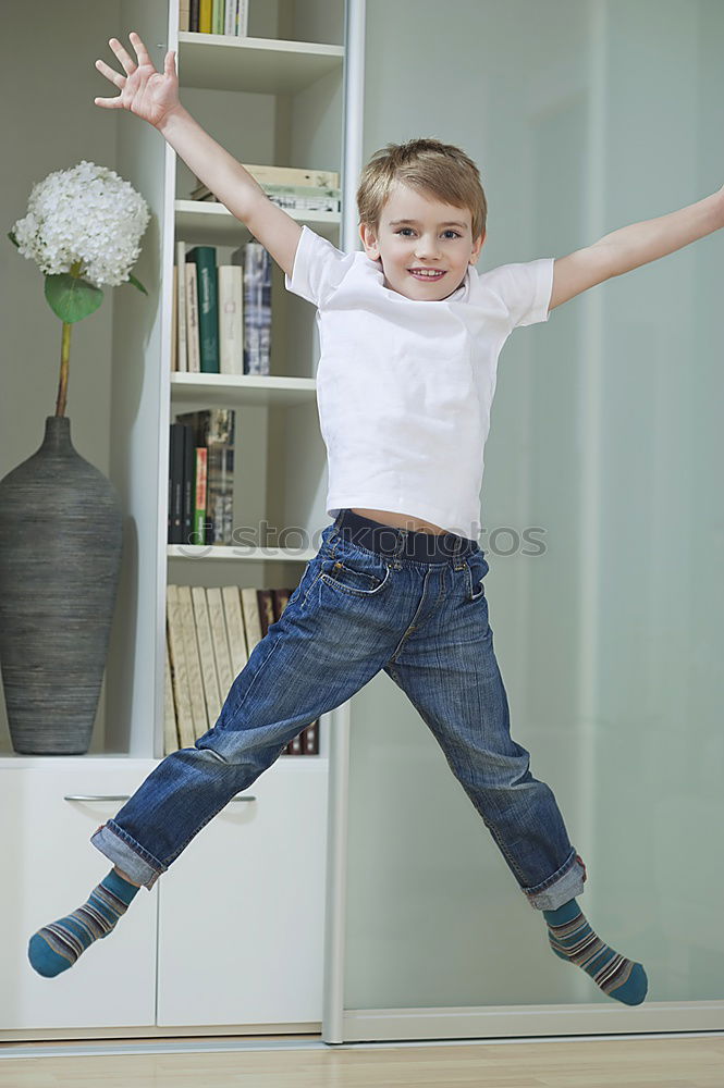 Similar – Image, Stock Photo A young teen wearing yellow T-shirt and jumping