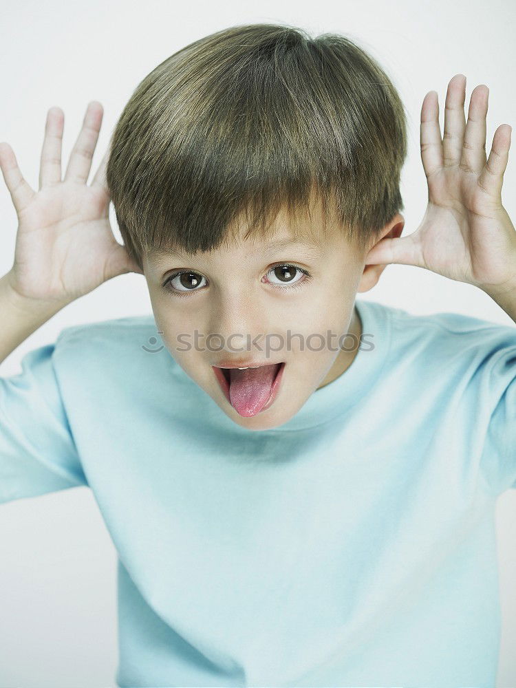 Similar – Image, Stock Photo Rude boy sticking out his tongue