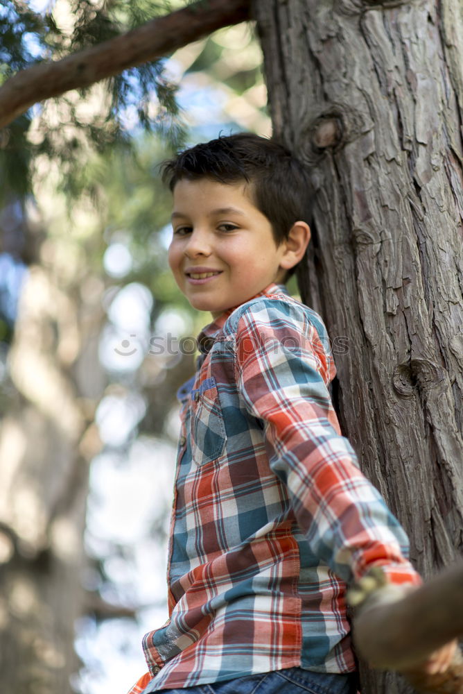 Similar – Cute child in the woods playing alone