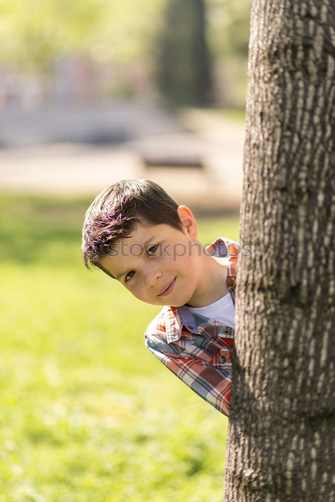 Similar – Cute child in the woods playing alone