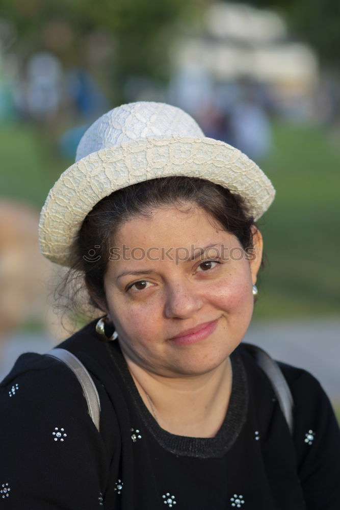 Similar – smiling mature woman with red hat