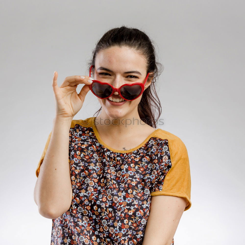 Similar – woman covering her eyes with pieces of sushi