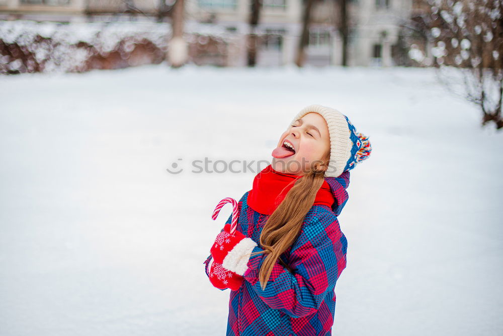 Similar – Image, Stock Photo Little girl enjoying winter walking through deep snow. Toddler is playing outdoors while snow falling. Child is wearing dark blue snowsuit and wool cap