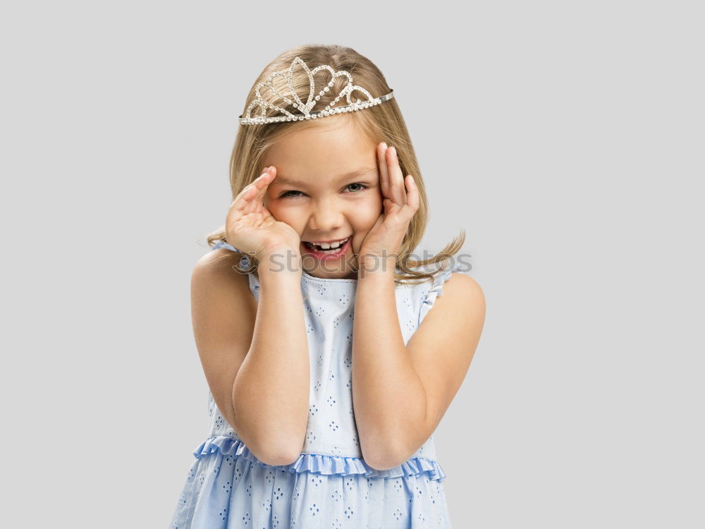 Similar – Little girl enjoying her role of princess. Adorable cute 5-6 years old girl wearing pink princess dress and tiara