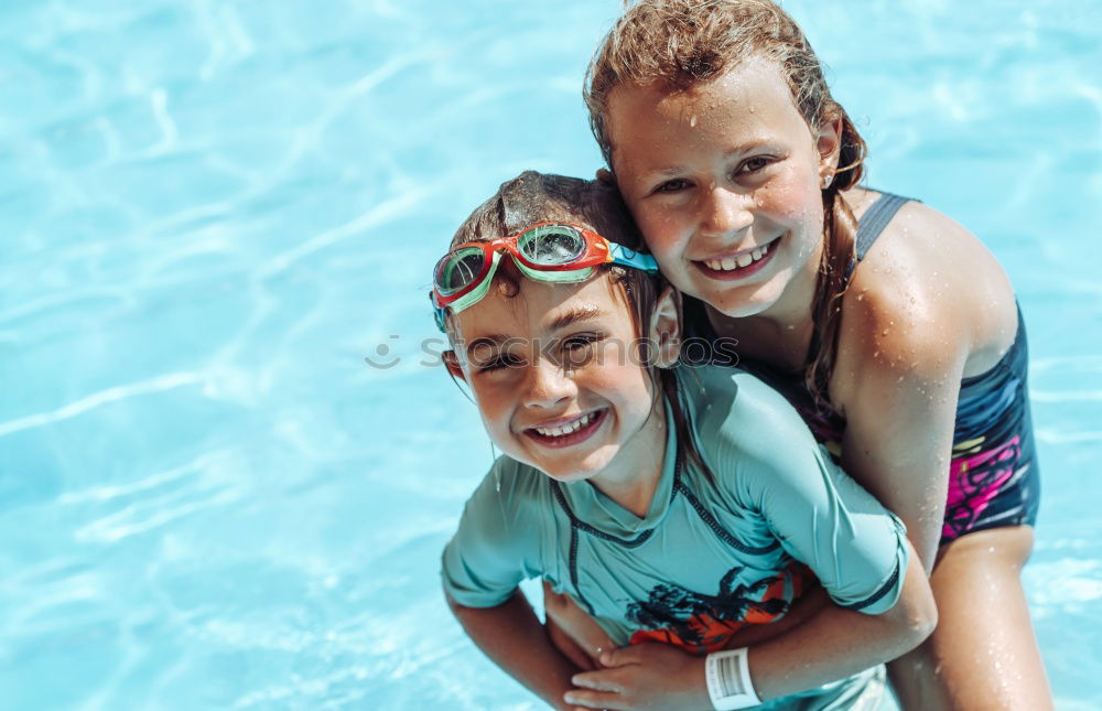 Similar – two little girls playing in the pool at the day time