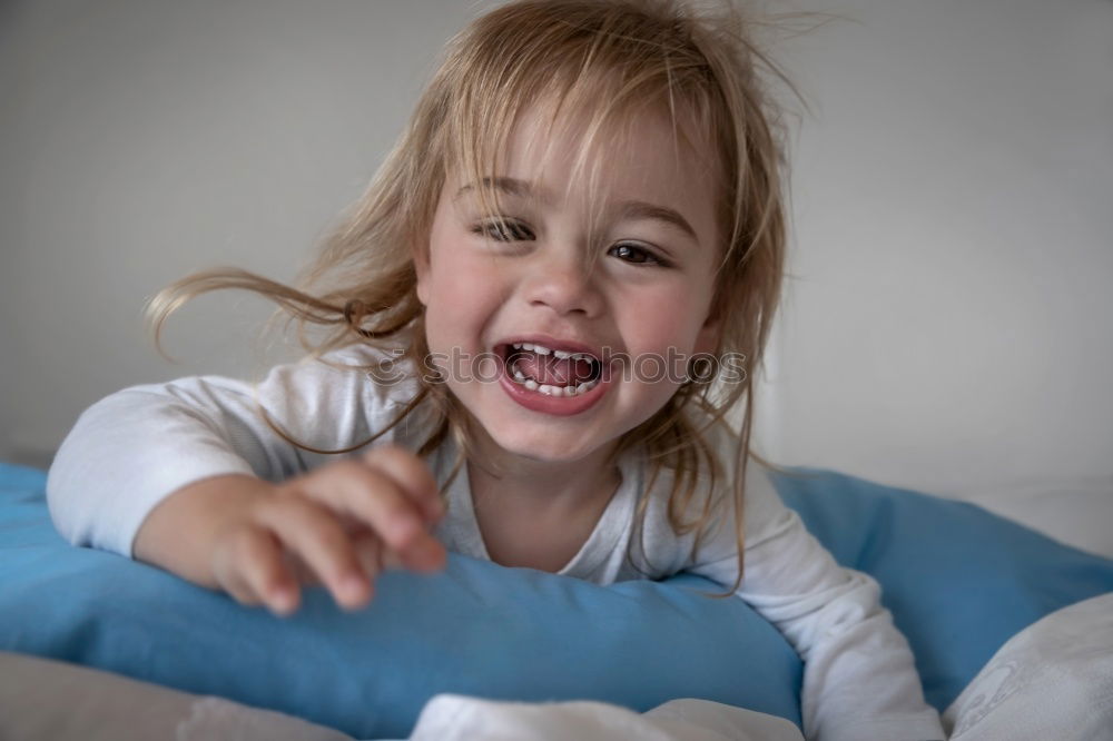 Similar – happy kid girl waking up in early morning