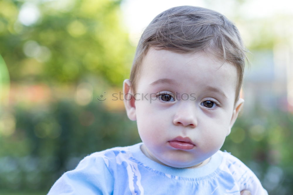 Similar – Image, Stock Photo Portrait of a three year-old boy sitting on the curb and looking left