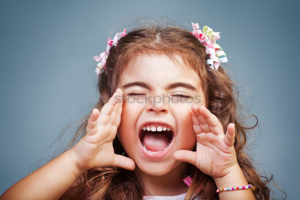 Similar – Young Girl Screaming With Closed Eyes