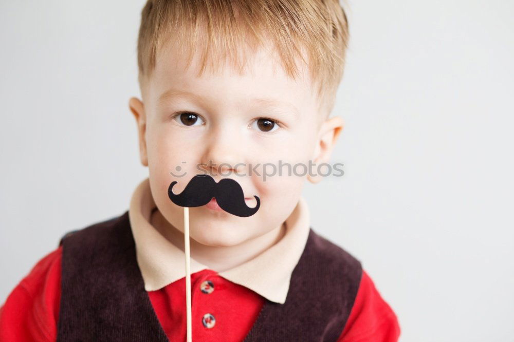 Similar – Funny boy with fake mustache and tie