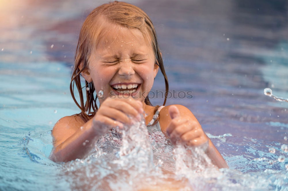 Similar – two little girls playing in the pool at the day time