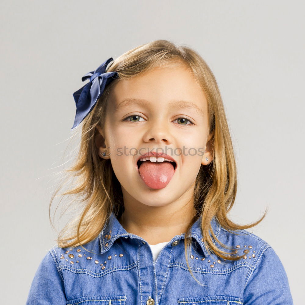 Similar – Image, Stock Photo Little girl sticking out her tongue