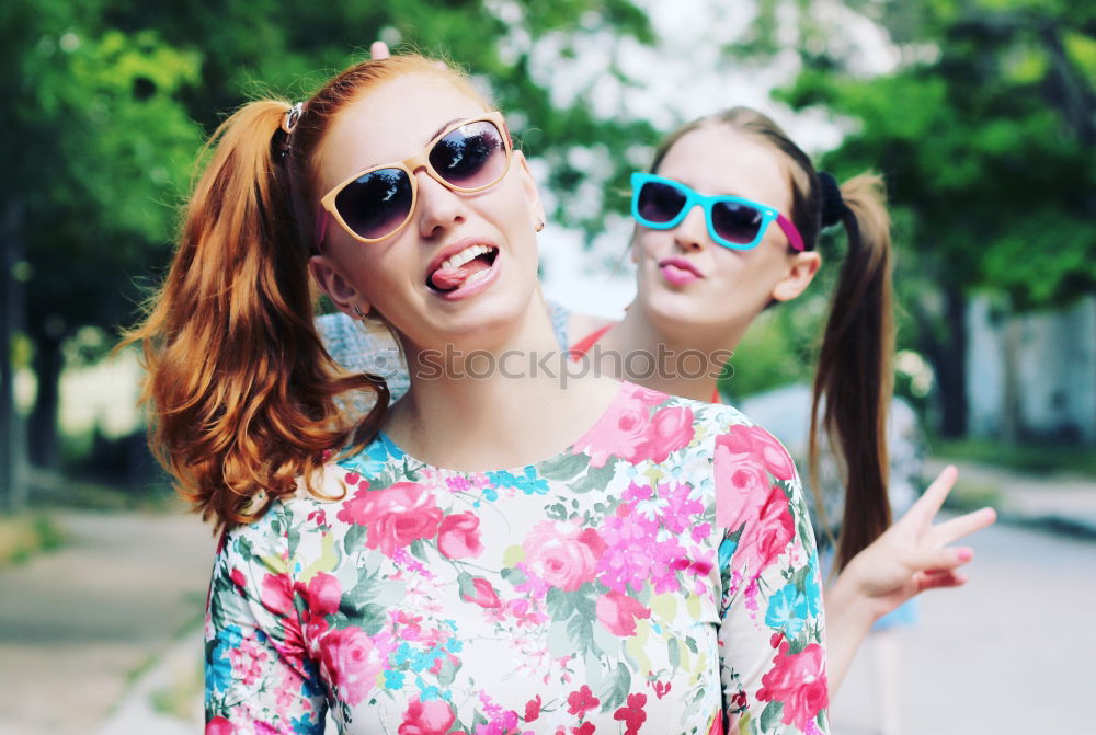 Similar – Two girls sitting on the bench and smile