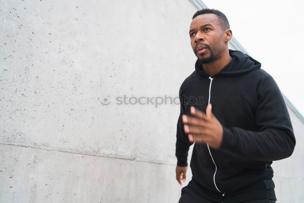 Similar – Handsome afro-american man biting his lip and looking aside in Gran via, Madrid.