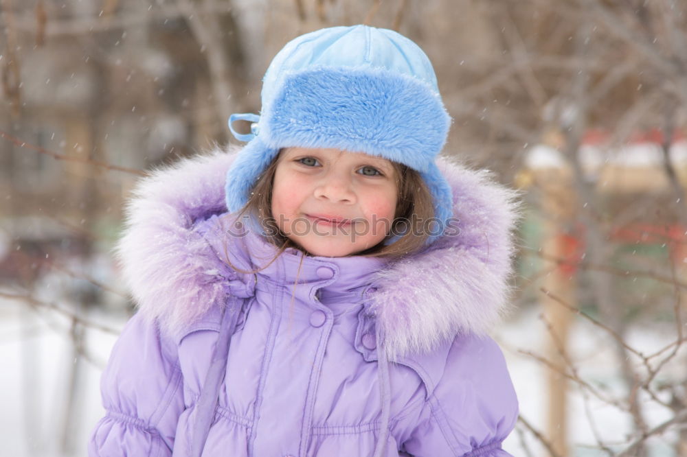 Similar – happy child girl skiing in winter snowy forest