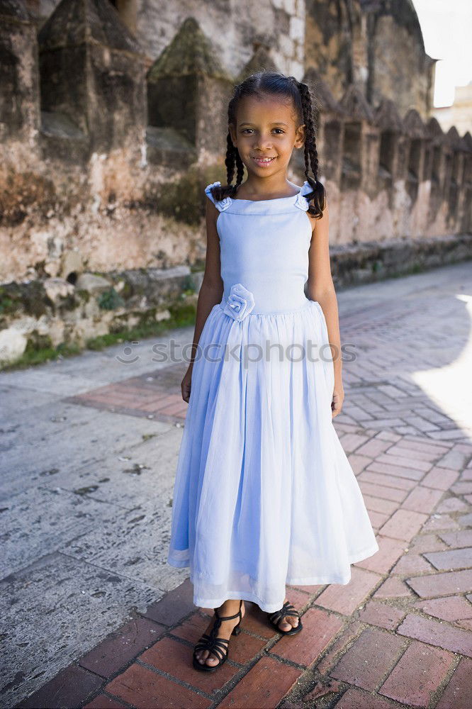 Similar – Young black woman, afro hairstyle, standing in the street