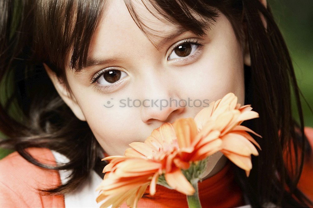 Similar – little girl observing flowers