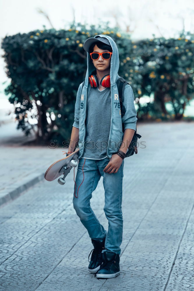 Young man wearing winter clothes in the street.