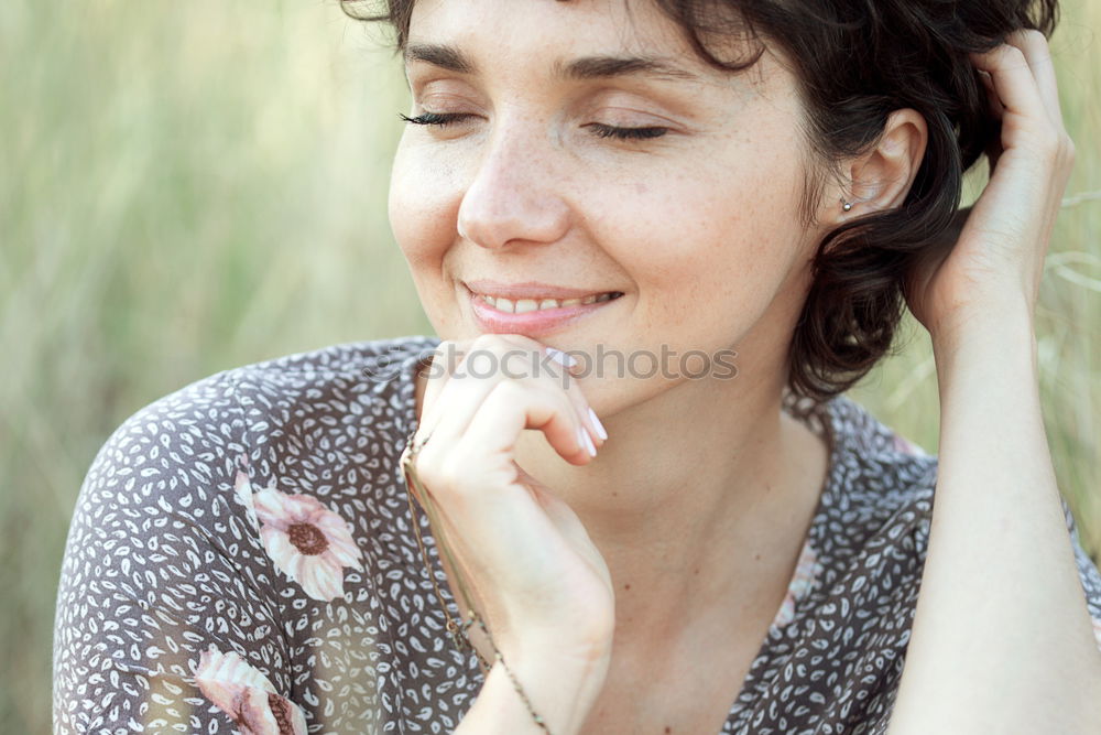 Similar – Happy senior woman sitting on the grass