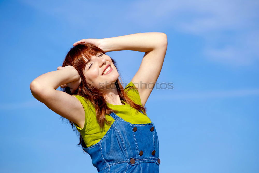 Similar – Cheerful woman in yellow jacket