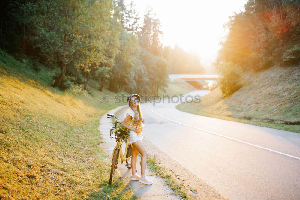 Similar – happy child girl walking country road with her dog