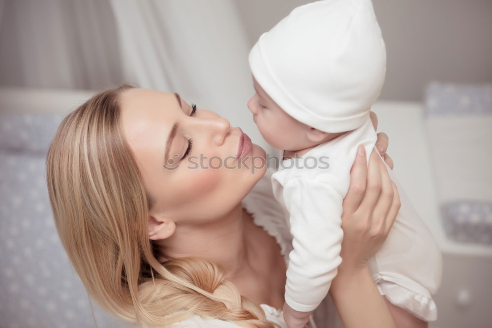 Similar – Image, Stock Photo Young Mother holding newborn baby