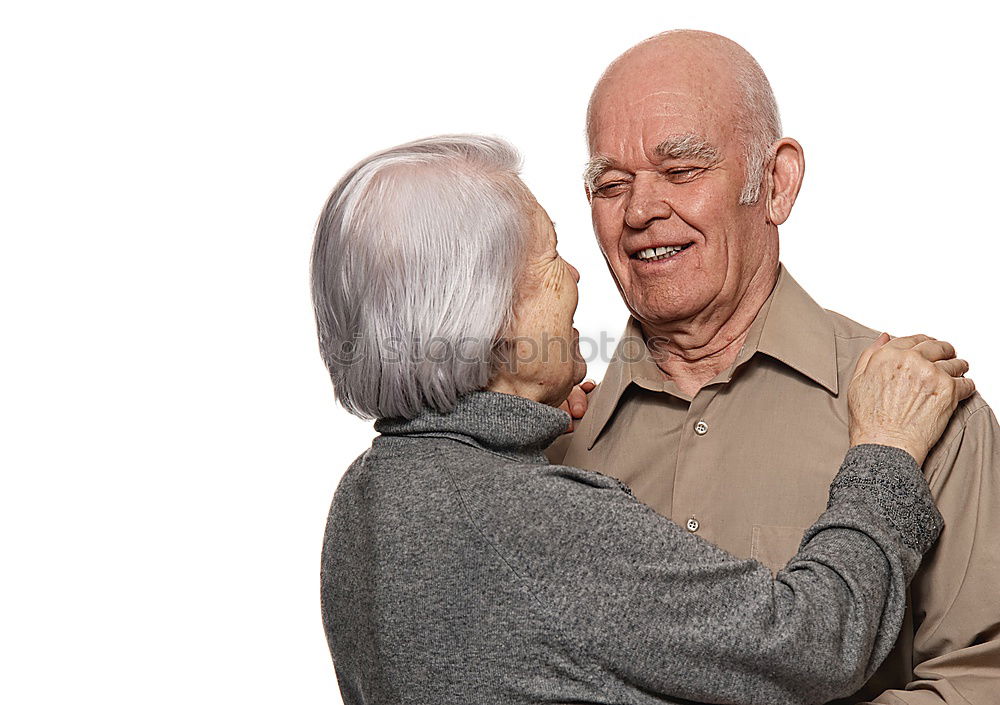 Similar – Smiling senior couple looks lovingly into each other’s eyes