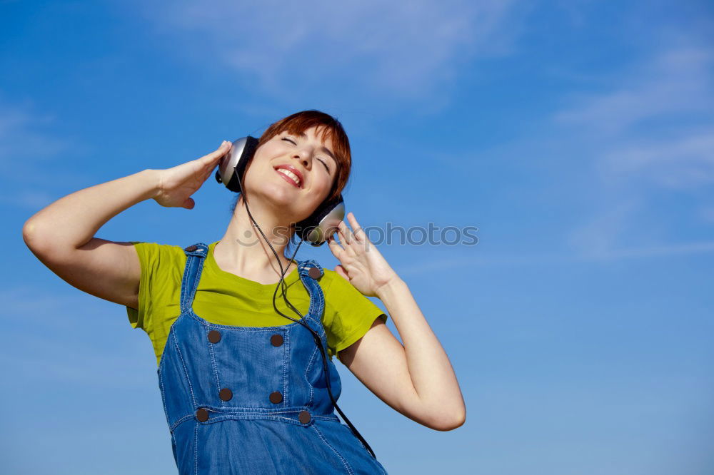 Similar – Cheerful woman in yellow jacket