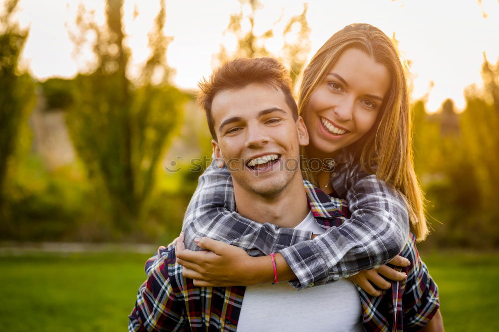 Similar – Beautiful young couple laying on grass in an urban park