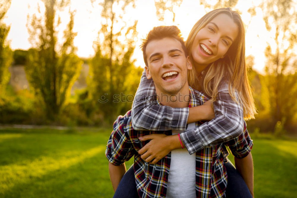 Similar – Beautiful young couple laying on grass in an urban park