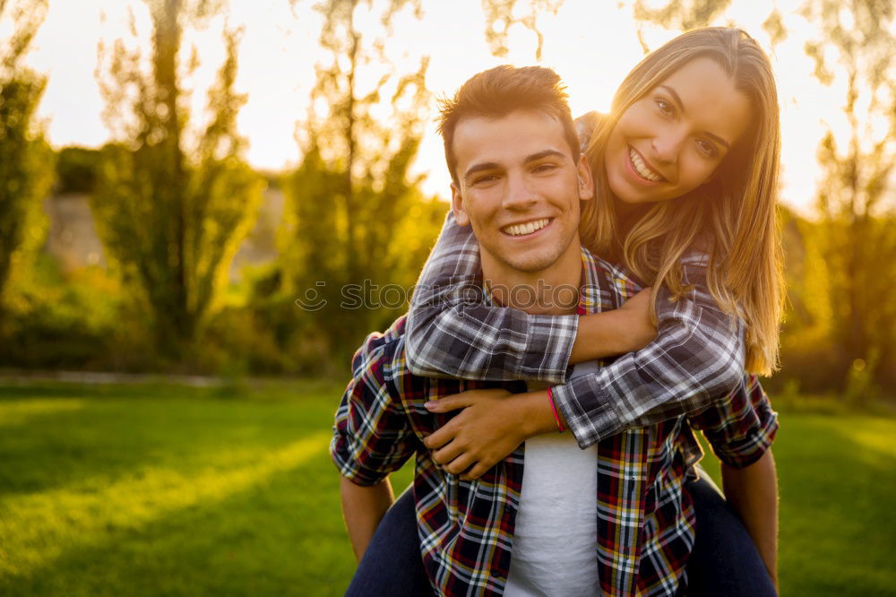 Similar – Beautiful young couple laying on grass in an urban park