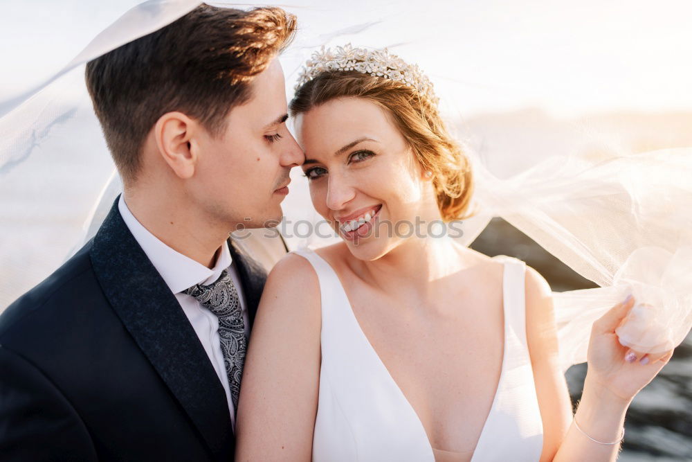 Similar – Image, Stock Photo Tender kissing bridal couple in sunlight