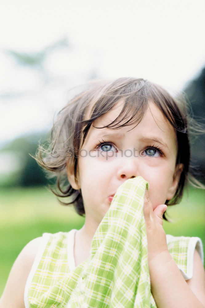 Similar – Cute, cute, cute, smiling, little, dreamy, sweet, sweet, blonde girl with pony and sweater in pink, pink observes, curious, interested, cheeky, his surroundings and holds on to the railing from the climbing on the playground.