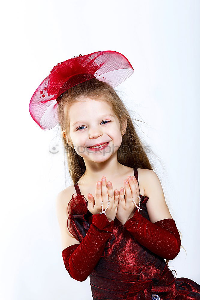 Similar – Image, Stock Photo Little playful, dreamy, pretty, beautiful, sweet, dressed up princess in pink, pink dress with tulle, stands at carnival, carnival as a spectator, visitors at the carnival procession in the street, on confetti and looks, watches, enjoys the party.