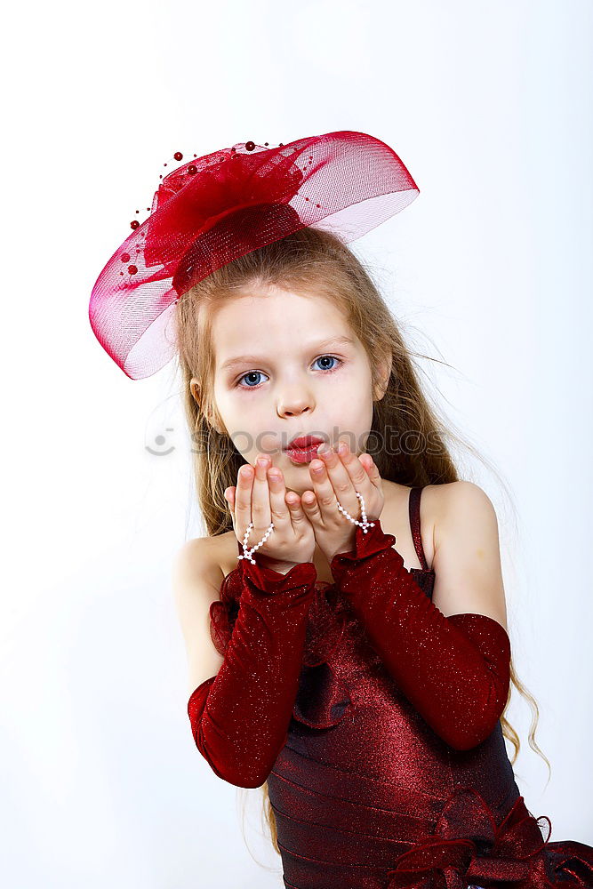 Similar – Image, Stock Photo Little playful, dreamy, pretty, beautiful, sweet, dressed up princess in pink, pink dress with tulle, stands at carnival, carnival as a spectator, visitors at the carnival procession in the street, on confetti and looks, watches, enjoys the party.