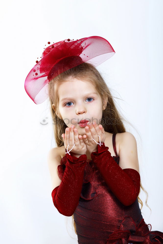 Similar – Image, Stock Photo Little playful, dreamy, pretty, beautiful, sweet, dressed up princess in pink, pink dress with tulle, stands at carnival, carnival as a spectator, visitors at the carnival procession in the street, on confetti and looks, watches, enjoys the party.