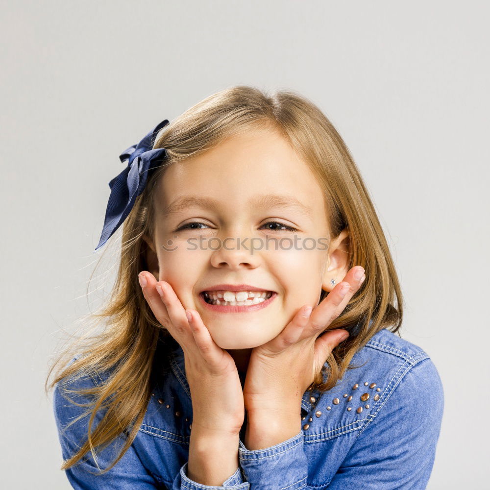 Similar – Adorable little girl with sweet smile lying down on bed.