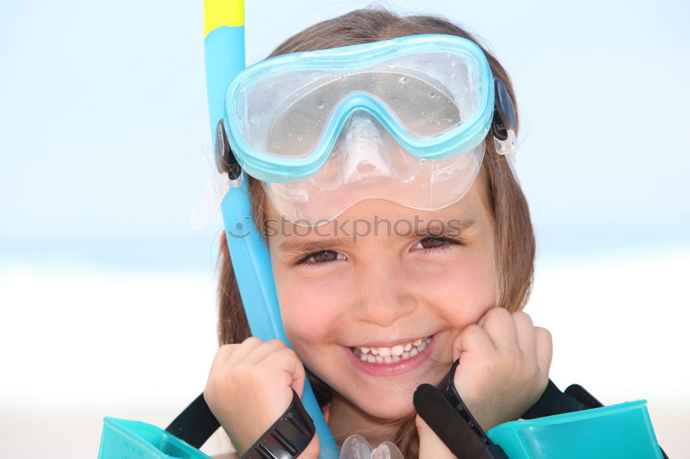 Similar – Kid in snorkel mask posing on poolside