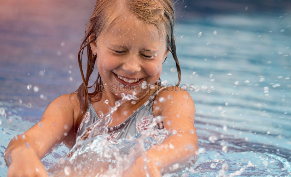 Similar – two little girls playing in the pool at the day time