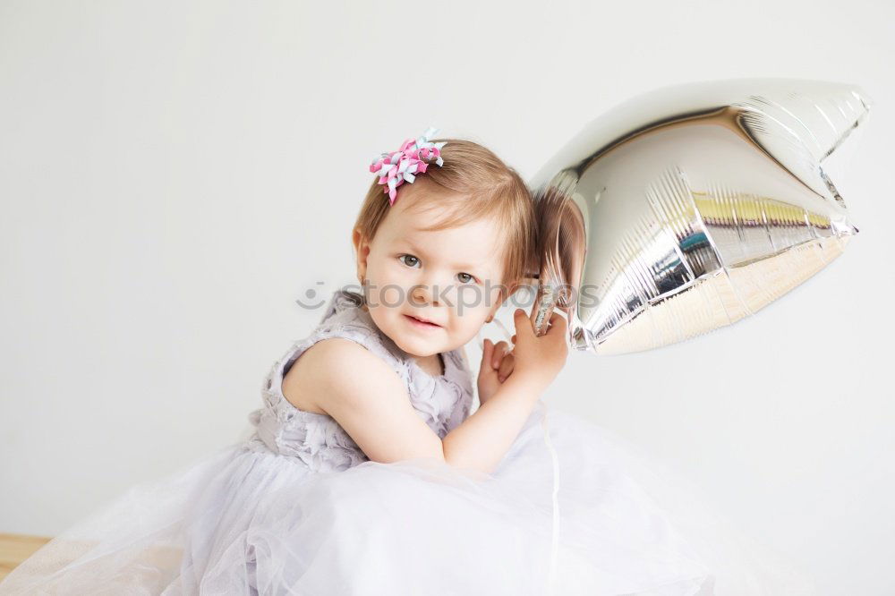 Similar – Image, Stock Photo portrait of a beautiful baby girl at home. Family concept indoor